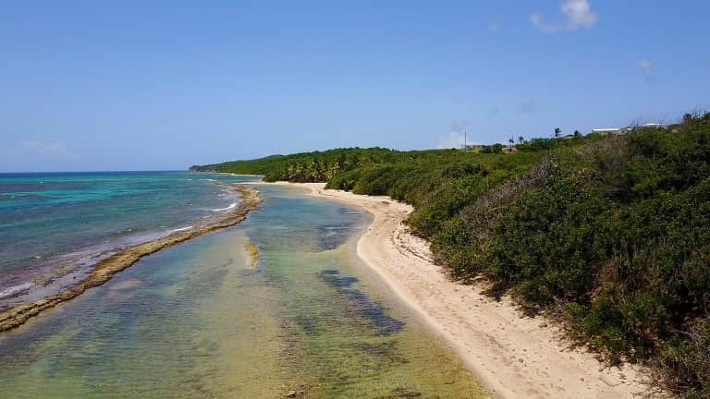 Aerial view of over a mile of uninhabited beach and reef at Vieques